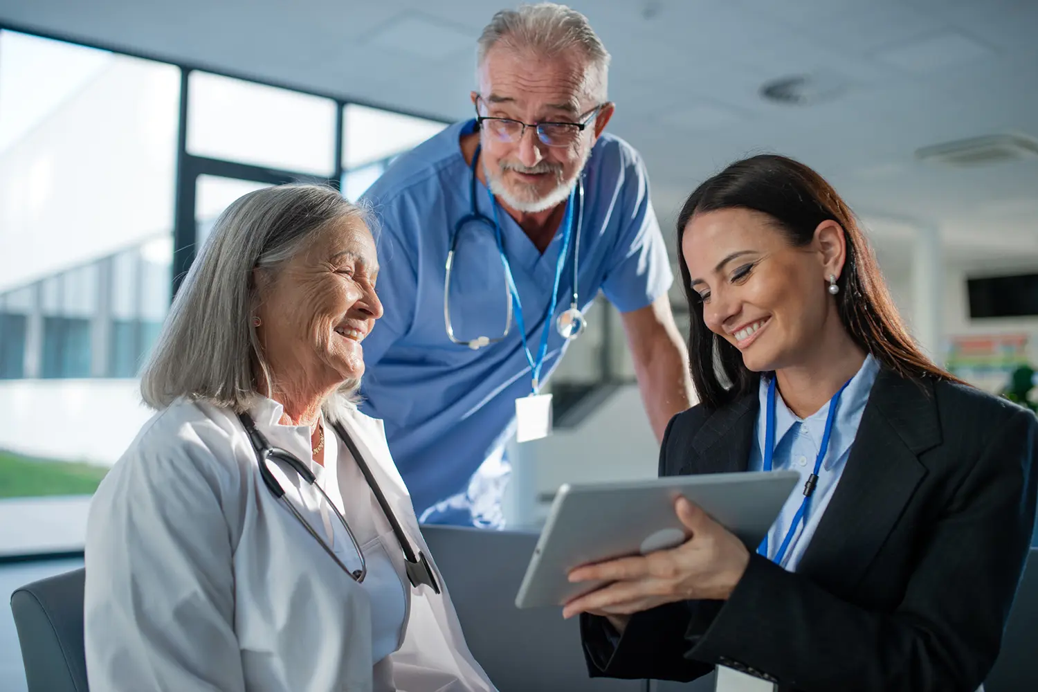 Medical team discussing patient records together.