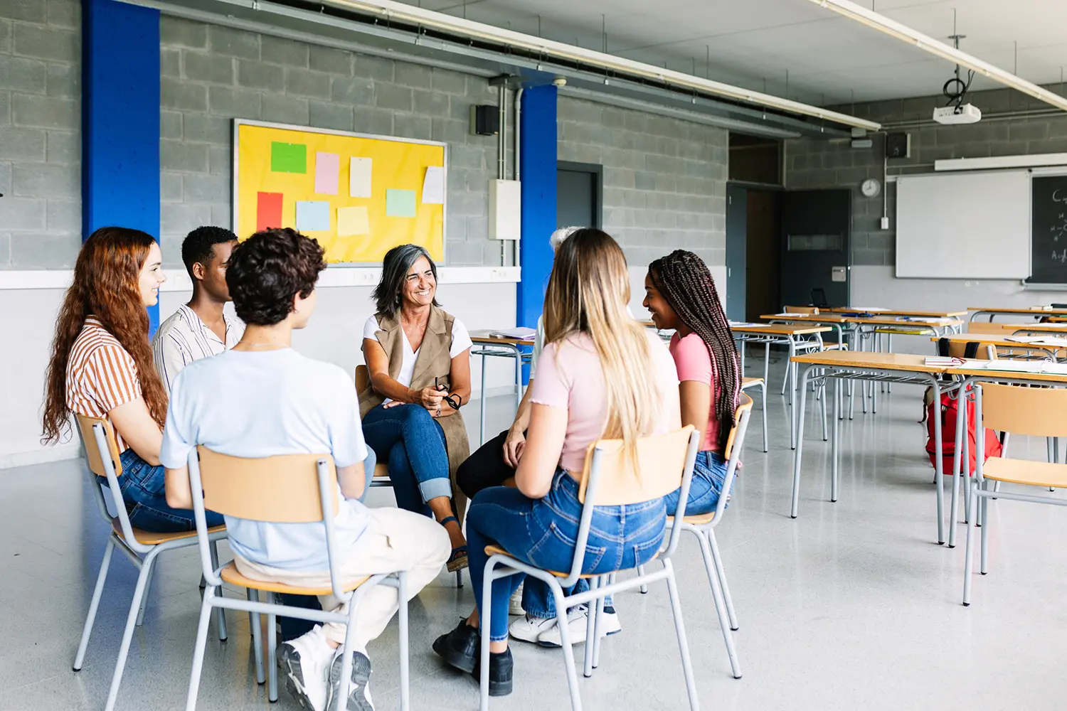 Group sitting in circle in classroom