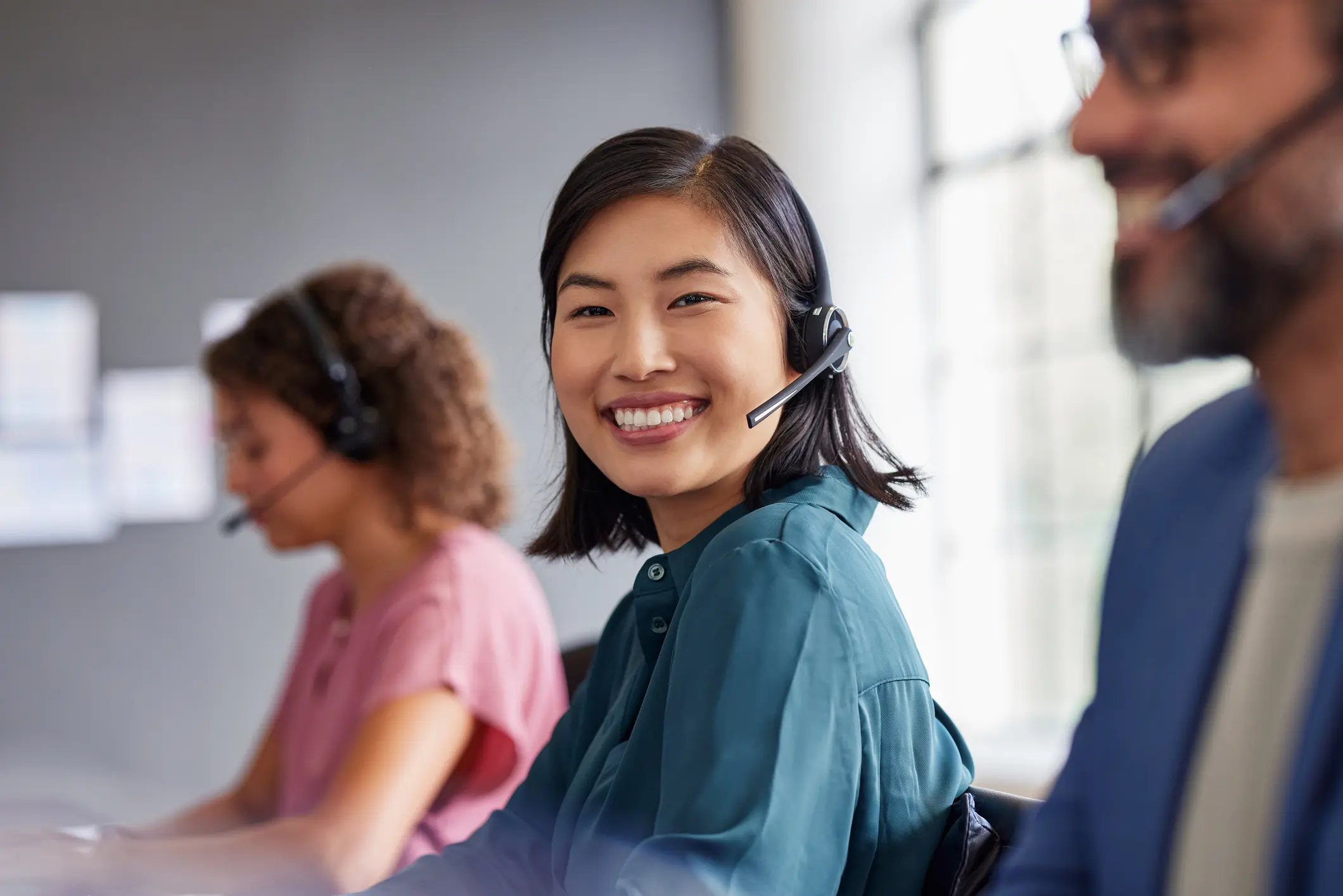 Smiling customer service agent wearing headset